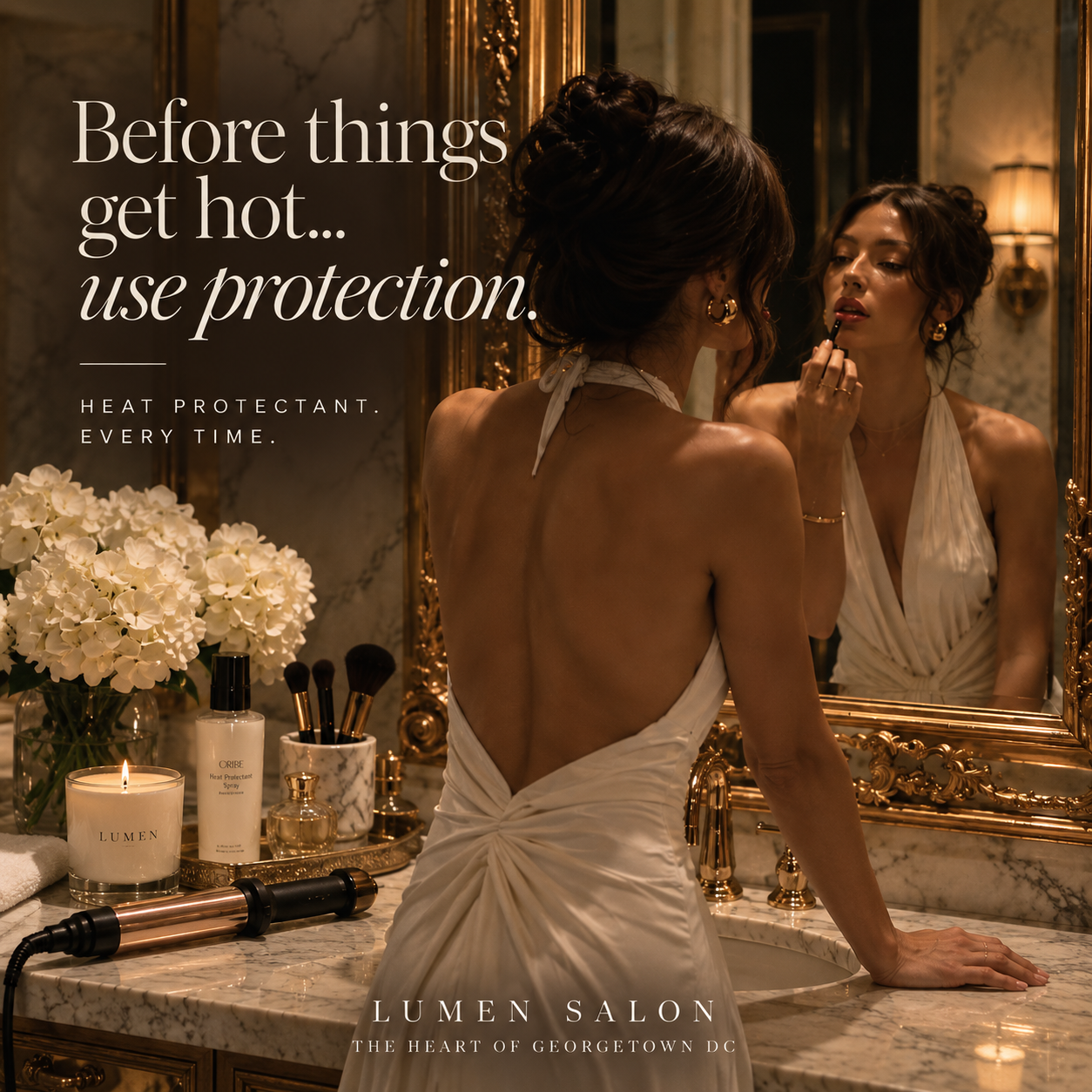 Woman styling her hair near hot tools, highlighting the importance of heat protectant to help prevent heat damage and hair breakage.